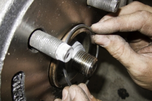 Mechanic Hands fixing brake pads